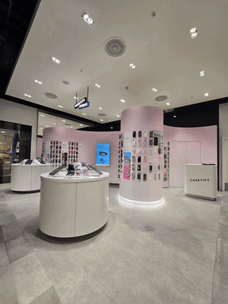 Wall display of phone cases inside the completed CASETiFY retail store