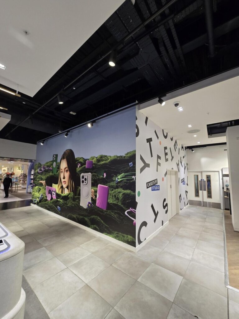 Wide-angle shot of the retail layout and customer flow area in CASETiFY store