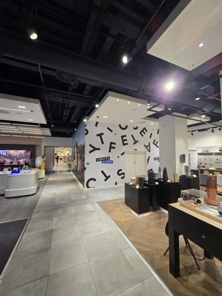 Custom fixture and shelving unit showcasing tech accessories at CASETiFY store